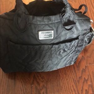 Black Marc Jacob diaper bag with changing pad